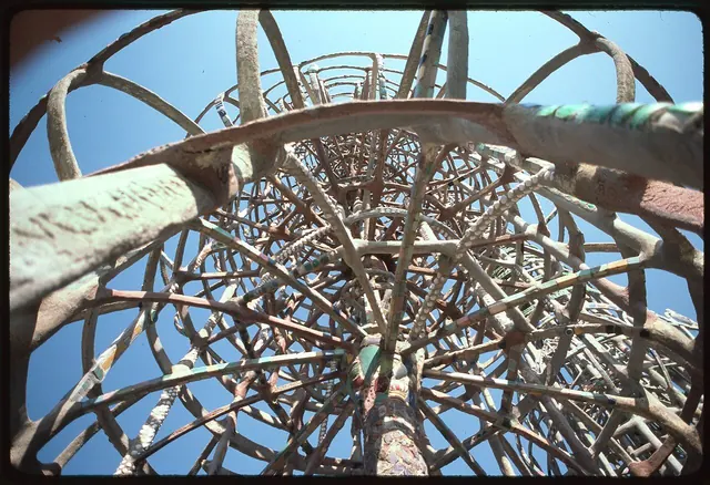 Tall mosaic towers of steel and broken tile