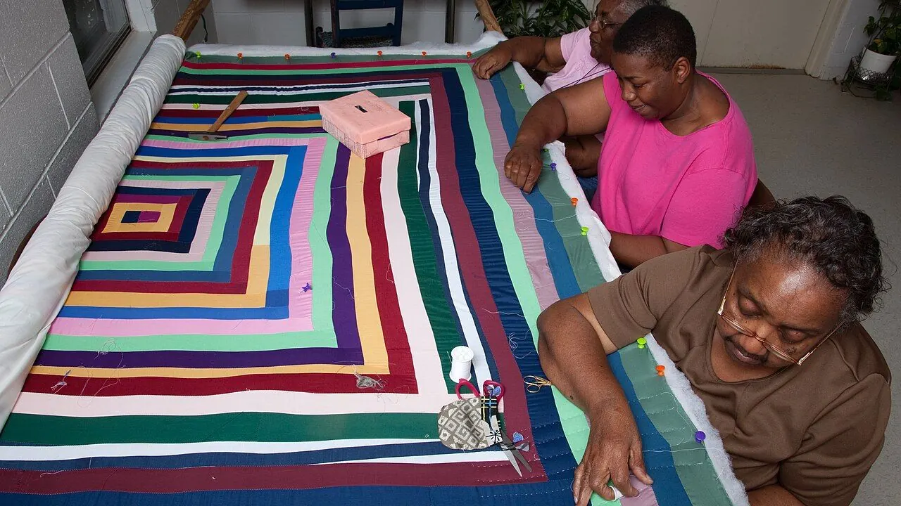 Colorful improvised patchwork quilt with bold geometric blocks