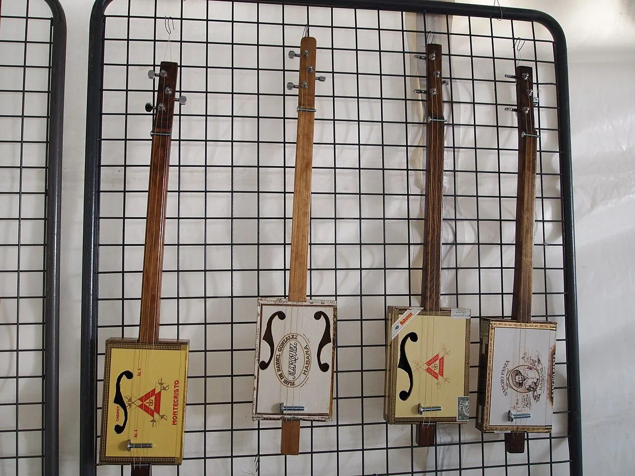 Handmade three-string cigar box guitar with a slide